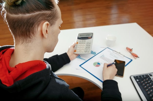A person meticulously calculating expenses using a calculator, with graphs showing financial projections in the background.