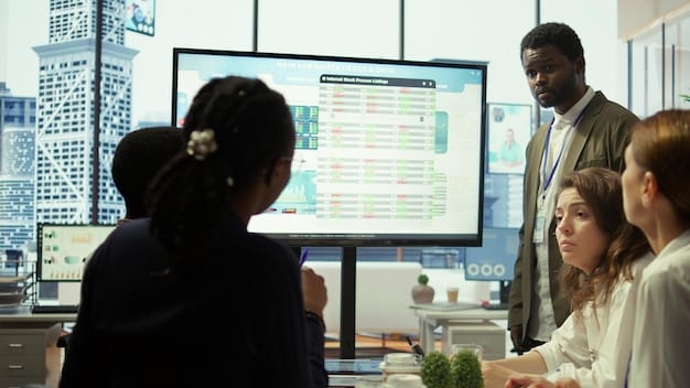 A diverse group of professionals collaborating on a project in a modern office, with one individual presenting data on a screen.