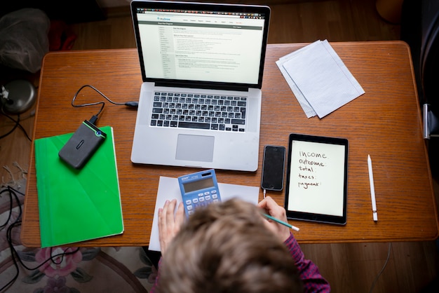 A laptop showing a tax preparation software interface with the Child Tax Credit section highlighted, emphasizing the digital tools available for claiming the credit.