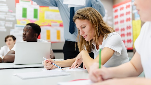 Students participating in a mock SAT exam in a classroom setting, showcasing the importance of practice and preparation for standardized testing.
