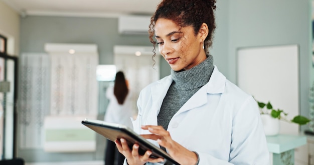 A person using a tablet to compare different healthcare plans, with a focus on understanding the details and changes in each plan, highlighting the importance of informed decision-making.