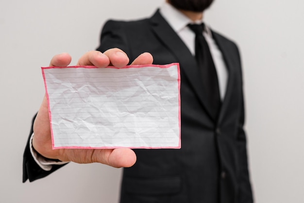 A close-up of a hand holding a check, with a background displaying state government buildings, symbolizing the process of claiming unclaimed state benefits.